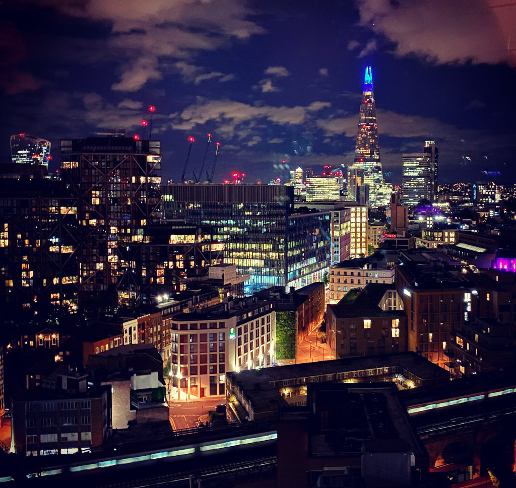 City of London at night with the Shard visible in the background