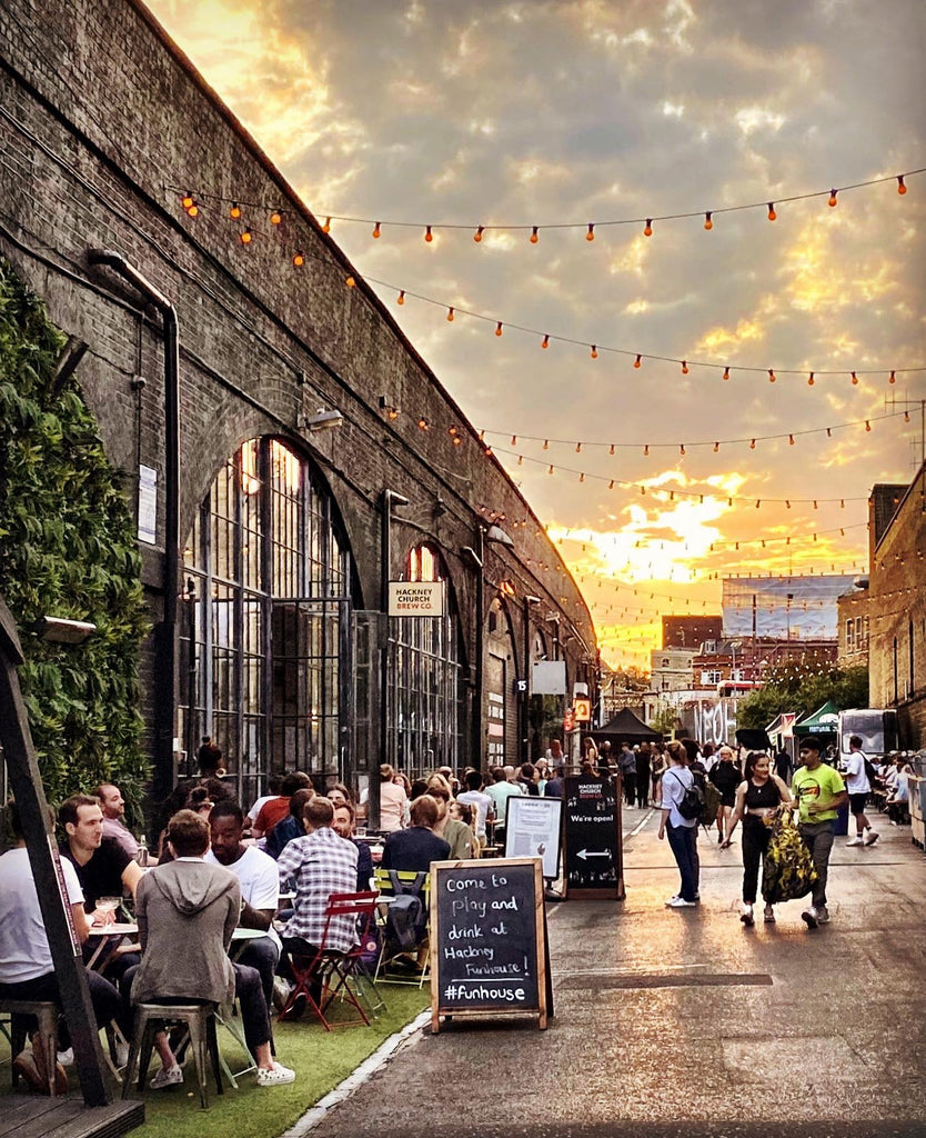 Hackney Bohemia Market with people during sunset